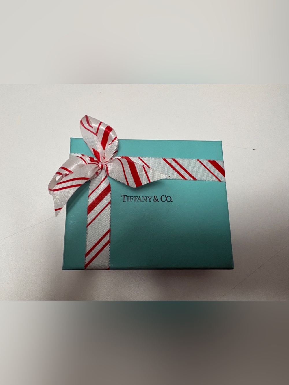 Tiffany & Co. box with candy cane ribbon and jewelry box and jewelry pouch